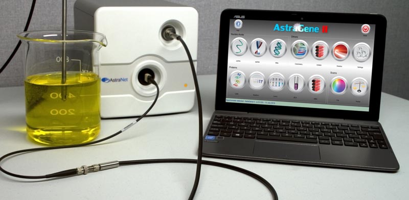 Photo of AstraGene II with dip probe and laptop